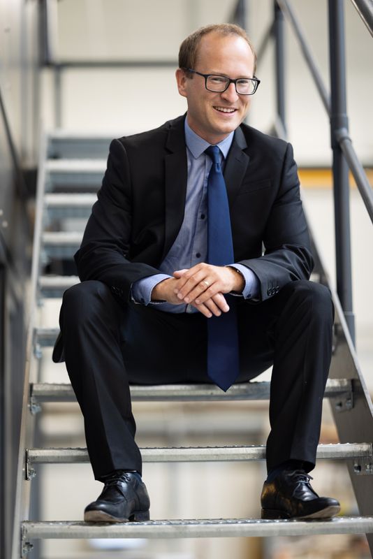 Tomas Havranek (Tomáš Havránek), seated on a staircase, 2022