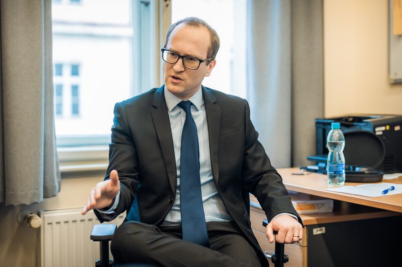 Tomas Havranek (Tomáš Havránek), explaining, seated, 2022